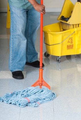 Baza Services LLC janitor in Athens, AL mopping floor.